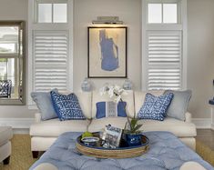 a living room with blue and white decor