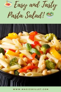 pasta salad with broccoli and peppers in a black bowl