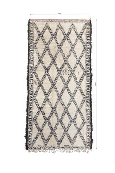 an old rug with black and white designs on the bottom, in front of a white background