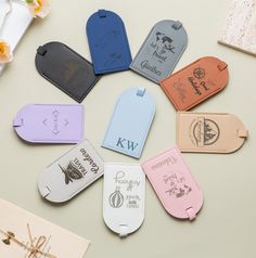 several luggage tags are arranged on a table