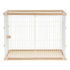 a white bird cage with wooden handles and bars