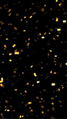 gold confetti falling down into the air