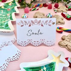 a table topped with lots of different types of cookies and candies on top of it