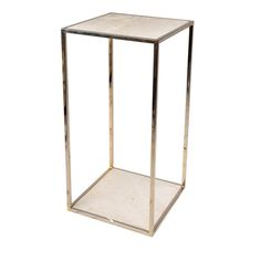 a glass and metal side table on a white background with no one in it's place