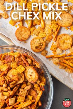 a bowl filled with chex mix next to some crackers