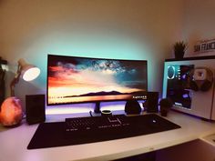 a desktop computer sitting on top of a white desk