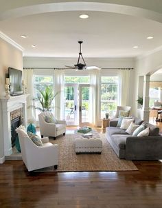 a living room filled with furniture and a fire place