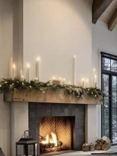 a living room with a fire place filled with candles