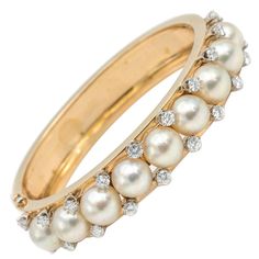 This stunning bracelet is beautiful showcasing a multitude of salt water pearls and twenty diamonds. The diamonds are VS/VS2 G/H set in 14k yellow gold and is very substantial. Pearl Bangles, Pearl Bangle Bracelet, The Bling Ring, Rose Gold Bangle, Pearl Bangle, Vintage Bangles, Diamond Bangles Bracelet, Diamond Jewelry Designs, Bracelets Gold Diamond