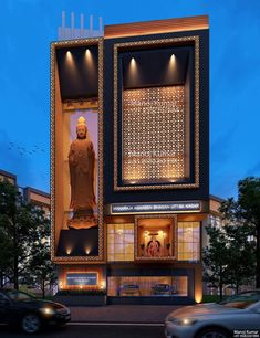 a large building with a buddha statue on the front