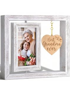 an old photo frame with a wooden heart hanging from the front, and a keychain attached to it