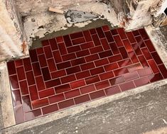 a red tiled floor in an old building