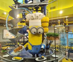 a statue of a minion is on display in a restaurant