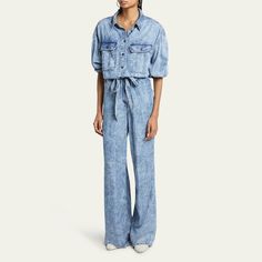 Etoile Isabel Marant "Paige" jumpsuit in light acid-wash denim  Spread collar; partial button front  Dropped shoulders Buttoned chest flap pockets Long sleeves; button cuffs Elasticized waistband with a self-tie belt  Slanted side and back patch pockets Full length  Straight legs Lyocell Lining: Cotton Dry clean Imported Belted Button-up Jumpsuit For Spring, Spring Belted Button-up Jumpsuits And Rompers, Spring Button-up Belted Jumpsuits And Rompers, Belted Button-up Jumpsuits And Rompers For Spring, Spring Workwear Washed Denim Jumpsuit, Spring Workwear Washed Jumpsuits And Rompers, Spring Workwear Jumpsuits And Rompers Washed, Spring Washed Denim Jumpsuit For Work, Spring Washed Jumpsuits And Rompers For Work