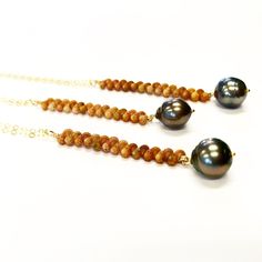 "This is listing is for one long handmade herringbone Ni'ihau shell necklace featuring a Tahitian Pearl in 14k gold fill, sterling silver or 14k rose gold fill. All shell are found off the coast of Kauai, Hawaii. Each shell is handpicked, cleaned, sorted by color, size, & quality, then drilled for stringing in a precise place of the shell to form this beautiful braided pattern. The pattern bring out any skin tone and the design fits very comfortably. This is a very good quality shell & pearl nec Niihau Shells, Braided Pattern, Vertical Bar Necklace, Vertical Bar, Herringbone Necklace, Kauai Hawaii, Shell Necklace, Shell Jewelry, Tahitian Pearls