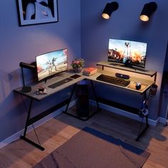 two computer monitors sitting on top of a desk next to a keyboard and mouse pad