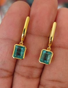 Genuine emerald 14kt gold emerald dangle earrings Total leanth of earring - 25mm approx Genuine emerald Genuine Diamonds Features: Material - 14kt yellow/White Gold 💖Gold Color - yellow Gold (if white gold needed please inquire) 💖Gemstone Stone - Emerald 💖Emerald Stone/- Rectangle/Emerald cut 💖Number of Emerald - 2 💖CRT weight of Emerald - 4.04Crt approx 💖Gems Stone Size - 6.4mm*7.8mm 2pc 💖width of Earrings - 7.5mm 💖 Earrings hight - 25mm Earring is ready to shipping, customer can demand Emerald Rectangular Earrings For May Birthstone, Rectangular Gemstone Earrings For May Birthstone, Fine Jewelry Emerald Rectangular Earrings, Rectangular Emerald Gemstone Earrings, Gold Rectangular Emerald Earrings, Rectangular Emerald Earrings Fine Jewelry, Gold Emerald Rectangular Earrings, Gold Emerald-cut Emerald Earrings, Gold Emerald Cut Emerald Earrings