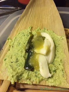 some kind of food that is on top of a wooden board