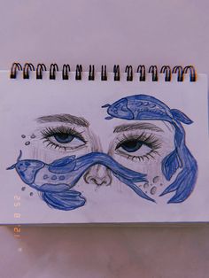 a drawing of a woman's face with fish around her eyes and the words mermaid written on it