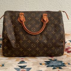 Louis Vuitton Monogram Speedy 30 In Excellent Condition Comes With Lock & Key 322 No Dust Bag Leather Pull Tab Broke Off. Listing Title: Louis Vuitton Monogram Canvas Speedy 30 Sku: 139644 Condition: Pre-Owned Condition Description: Originally Called The 'Express' Bag, Louis Vuitton's Speedy Bag Is A Style That Has Been Around Since 1930. The Barrel-Shaped Bag Is One Of The House's Most Popular Bags, Coming In A Number Of Patterns And Different Sizes. Audrey Hepburn Famously Influenced The Desig Monogram Canvas Satchel With Gold-tone Hardware For Errands, Classic Monogram Canvas Bag With Branded Hardware, Daily Use Satchel With Branded Hardware And Monogram Canvas, Designer Monogram Canvas Satchel For Errands, Classic Monogram Canvas Satchel For Everyday, Vintage Monogram Canvas Satchel For Shopping, Classic Satchel With Dust Bag For Errands, Bags Wishlist, Speedy Bag