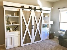 a living room with two sliding doors in it