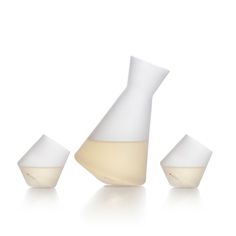 three white vases sitting next to each other