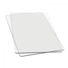 three clear plastic sheets are stacked on top of each other, with one sheet in the middle