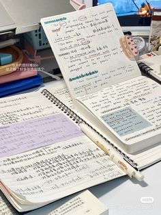 an open notebook sitting on top of a desk