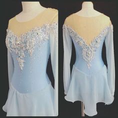 a blue dress with silver sequins on the shoulders and long sleeves is shown