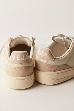 Donning a chunkier court silhouette, these low-top sneakers from Veja featured Organic Traced leather uppers complete with a perforated toe box and Amazonian rubber outsole. **Features:** Low-top style, Organic Traced leather uppers, padded collar, perforated toe box, Amazonian rubber outsole, recycled lining, lace-up closure **Why We | Veja V-90 Sneakers at Free People in Tan, Size: EU 37 Brown Tennis Shoes, Brown Tennis, Shoes Veja, Street Beat, Neutral Shoes, Vegan Shoes, Winter 2024, Shoe Obsession, Shoes Trainers