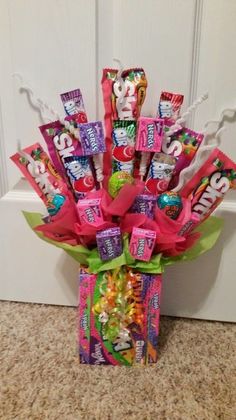 the candy bouquet is sitting on the floor