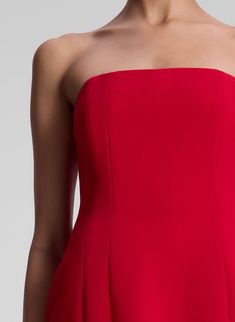 The Elsie Dress, a part of A.L.C.'s Signature Collection, is impeccably cut from vibrant red silk cady. This mini silhouette is strapless, featuring boned corsetry, pockets, and darted seams for a feminine fit. Shop Dresses. Styling Tip: Style with tonal heels and a sleek clutch for a striking monochromatic evening look. Elsie Dress, Strapless Knit Dress, Pleated Satin Dress, Silk Bodysuit, Embellished Maxi Dress, Strapless Midi Dress, Cotton Midi Dress, Strapless Mini Dress, Red Silk