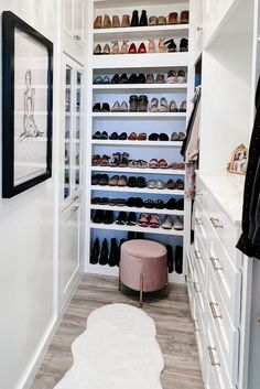 a walk in closet filled with lots of shoes