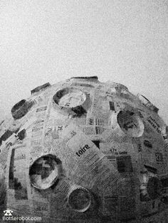 a large round object made out of newspapers