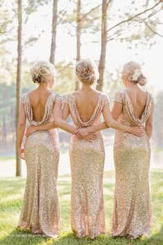 three bridesmaids in sequin dresses looking at each other with their back to the camera