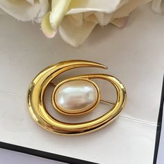 This gorgeous Monet gold plated faux pearl brooch is vintage from the 1980s. Width: 3.5cm. Length: 4.5cm. Clearly marked: MONET. www.vintageamara.co.uk Vintage Monet Jewelry, Retro Gold Brooch For Anniversary, Retro Gold Brooches For Evening, Retro Gold Brooch For Evening, Gold Retro Brooches For Evening, Monet Jewelry, Vintage Monet, Pearl Brooch, The 1980s