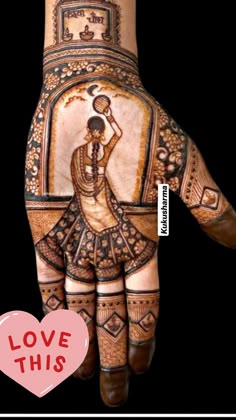 a woman's hand painted with henna and an image of a woman on it