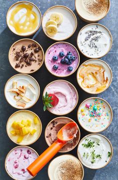 an assortment of desserts in small bowls on a table