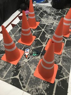 there are many traffic cones on the floor