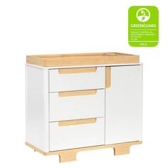 a white cabinet with two drawers and a wooden shelf on the bottom that has greenguard stickers above it