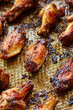 fried chicken pieces on a baking sheet ready to be cooked in the oven or frying