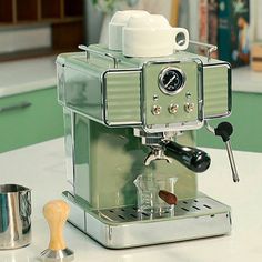 an espresso machine sitting on top of a counter