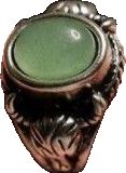 an ornate ring with a green stone in the center