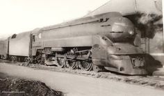 an old black and white photo of a train