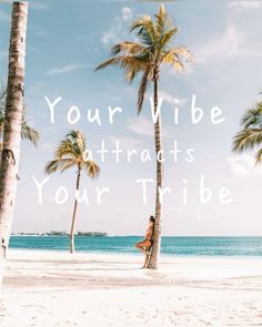 a woman sitting on top of a palm tree next to the ocean with text reading your wide attracts your tribe