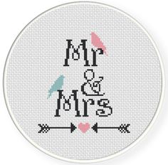 a cross stitch pattern with the words mr and mrs in black, white and pink