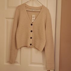 Woman's Long Sleeve 4 Button Front Cardigan. Never Worn. Still Has Tag. 92% Acrylic/ 8% Polyester V-neck Sweater With Button Closure For Day Out, V-neck Cardigan With Buttons For Day Out, Everyday Button-up Sweater With Buttons, Button-up Cardigan With Button Closure For Daywear, Spring Cream Sweater With Button Closure, Cream Button Closure Sweater For Spring, Beige Buttoned Cardigan For Day Out, Casual Daywear Sweater With Button Closure, Cream Cardigan With Buttons For Spring