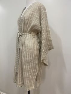 Special design light weight bat sleeve kimono robe. The ultimate in luxurious comfort, our superior linen kimono robe is as indulgent as it is beautiful. SPECIFICATION * Fabric: %85 linen and %15 cotton blend * Color : beige * Size : one size fits all, a loose cut kimono for Small / Medium / Large size women * Attributes : natural organic linen and cotton blend fabric, garment wash CARE INSTRUCTION * Machine Wash Warm and separately * Iron inside out and Warm * Dryclean You may order luxurious g Elegant Long Sleeve Robe For Vacation, Elegant Wrap Robe For Vacation, Elegant Long Robe For Vacation, Elegant Long Vacation Robe, Summer Daywear Kimono With Tie Waist, Summer Kimono With Tie Waist For Daywear, Elegant Beach Kimono With Tie Waist, Elegant Tie Waist Kimono For Beach, Long Sleeve Beach Robe With Tie Waist