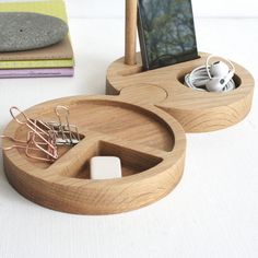 an electronic device is sitting in a wooden holder