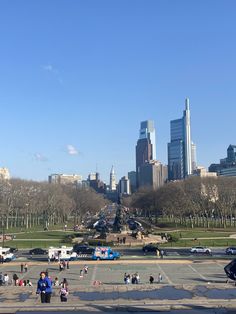 people are walking around in the city park